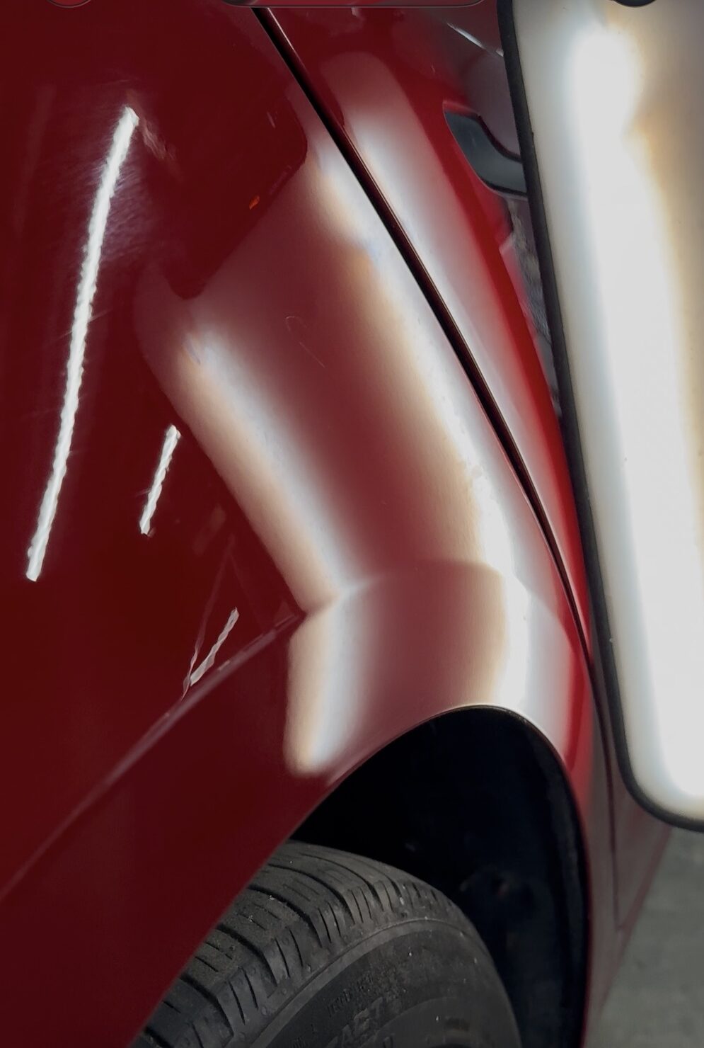 Door panel after paintless dent repair