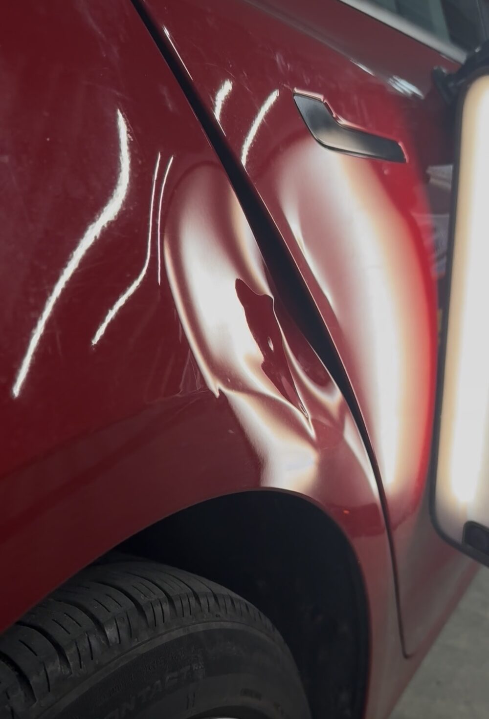 Door panel dent before repair